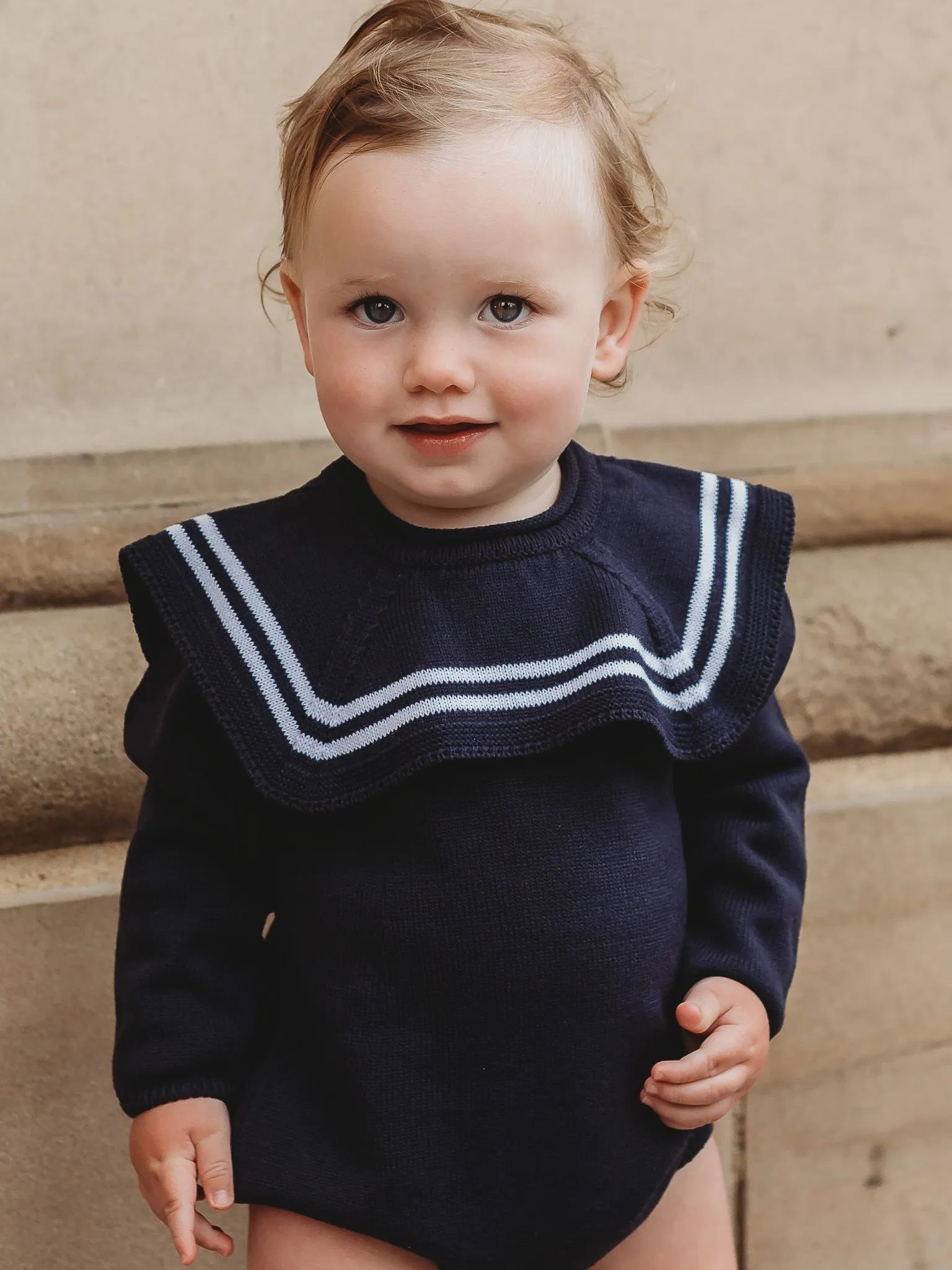 'Arhlo' navy & white knitted romper with sailor collar