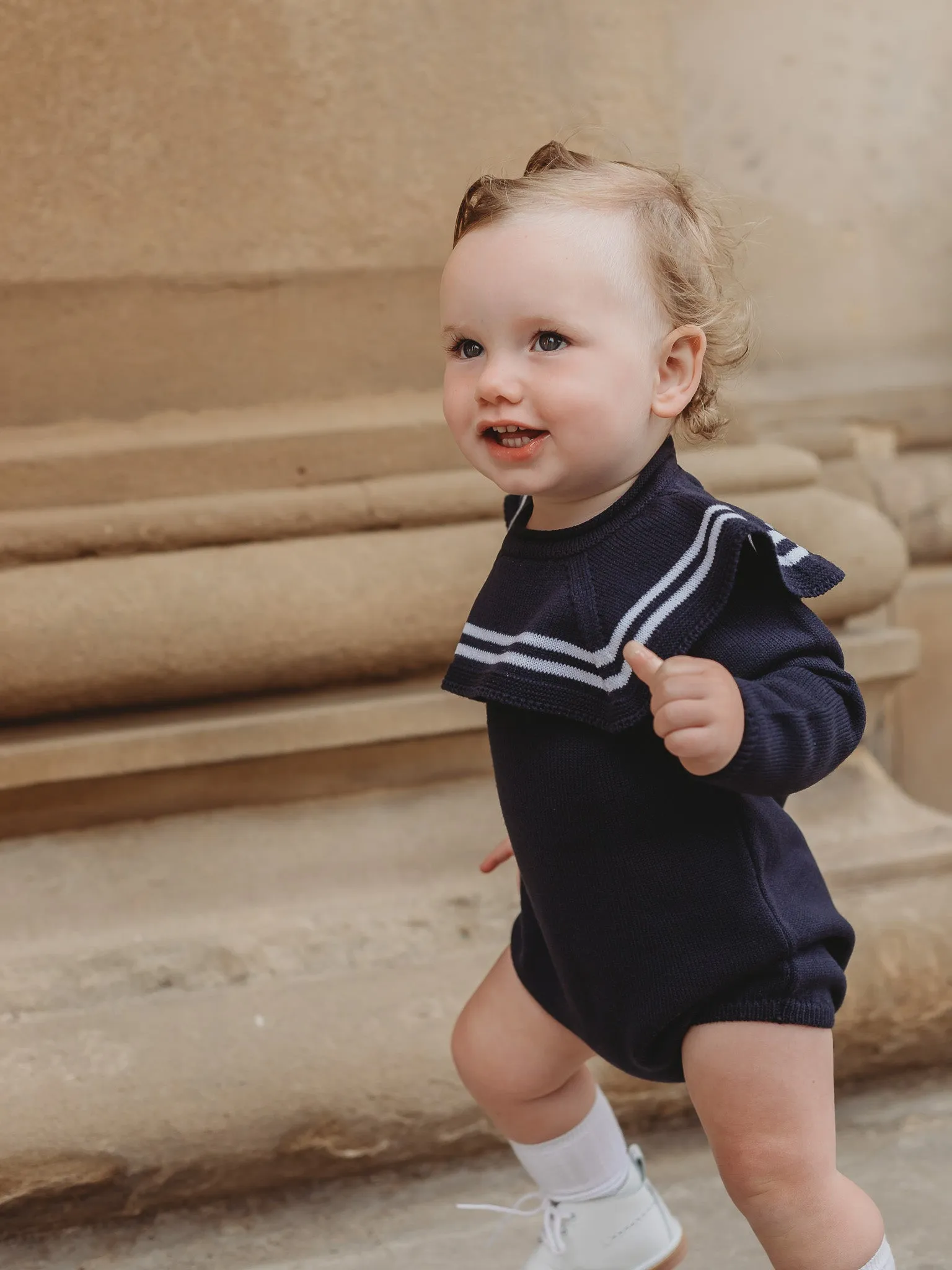 'Arhlo' navy & white knitted romper with sailor collar