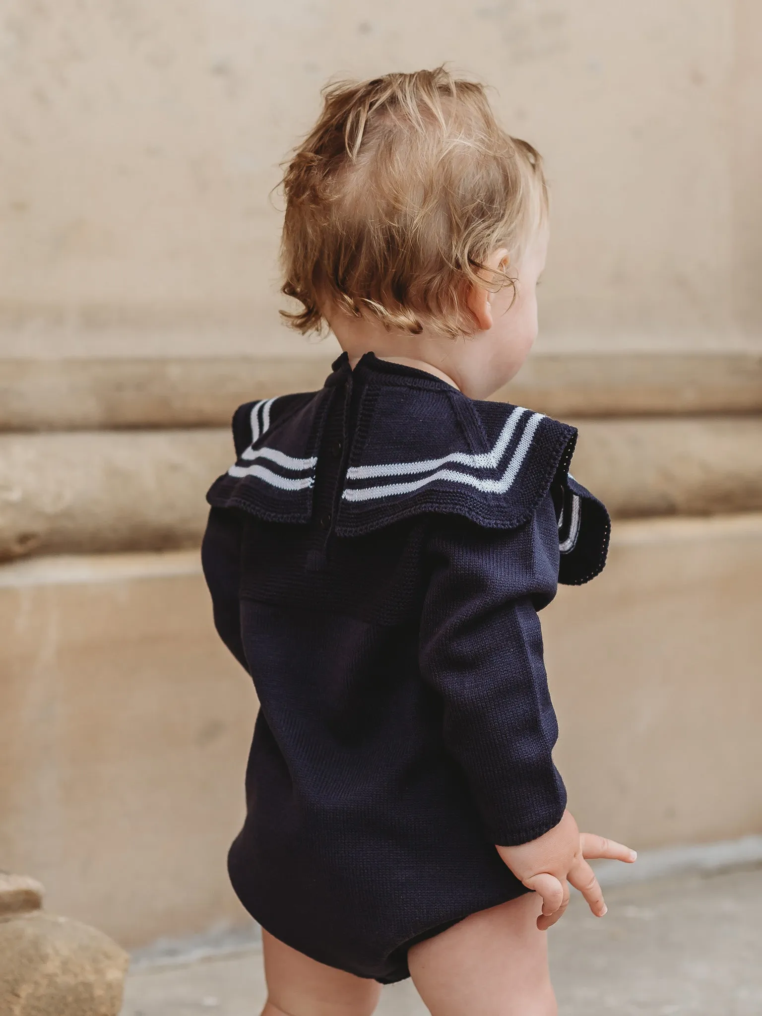 'Arhlo' navy & white knitted romper with sailor collar