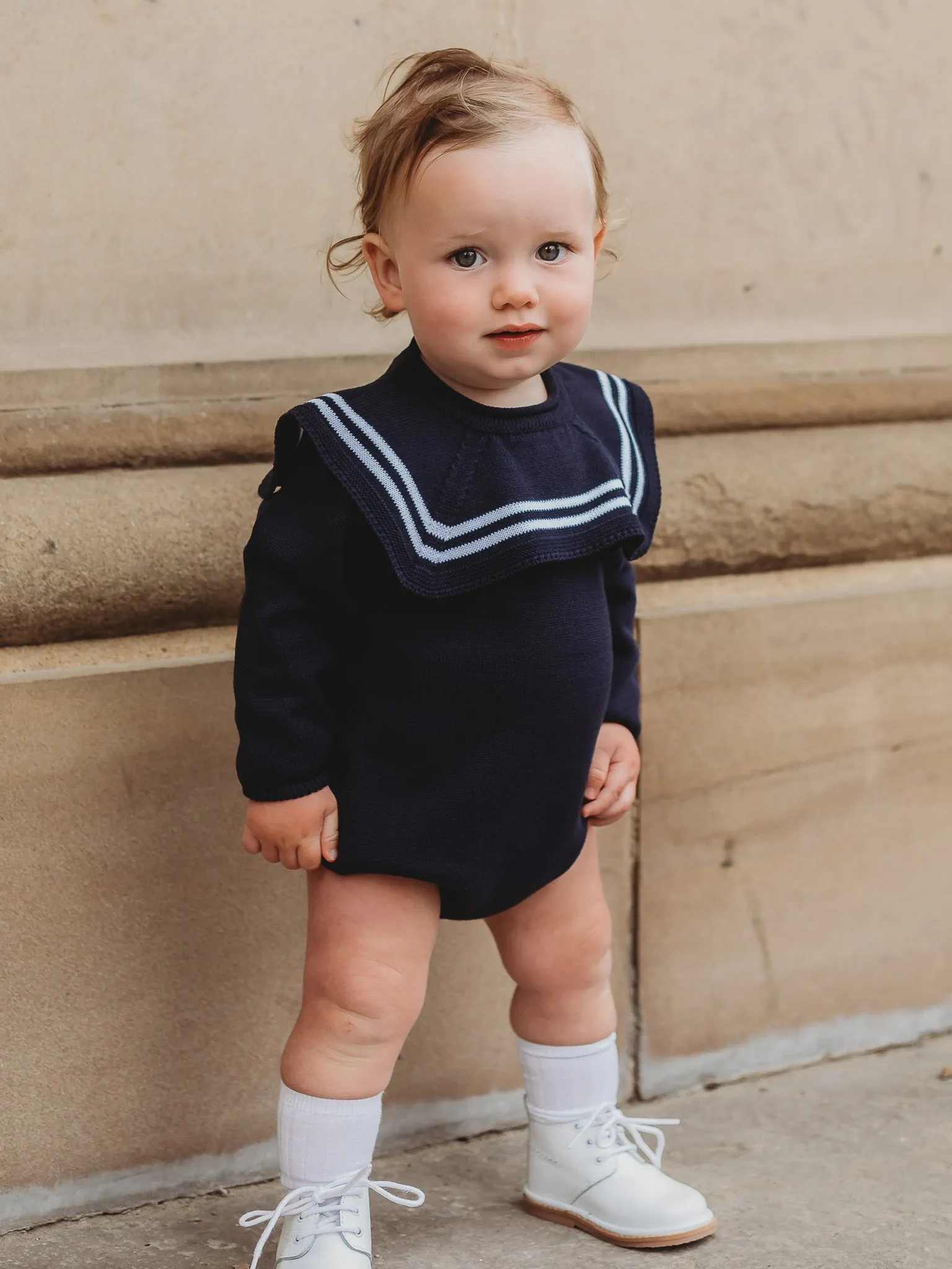 'Arhlo' navy & white knitted romper with sailor collar