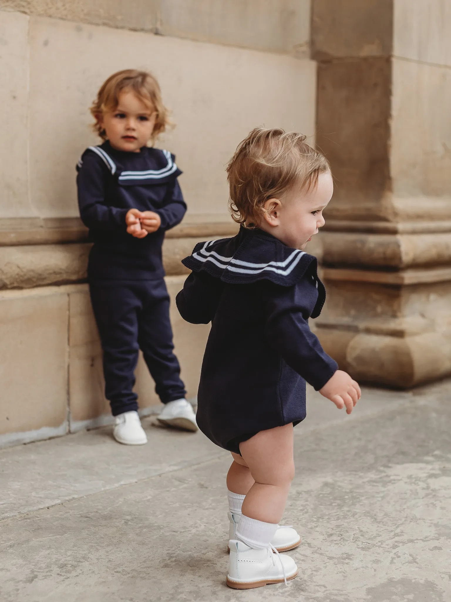 'Arhlo' navy & white knitted romper with sailor collar