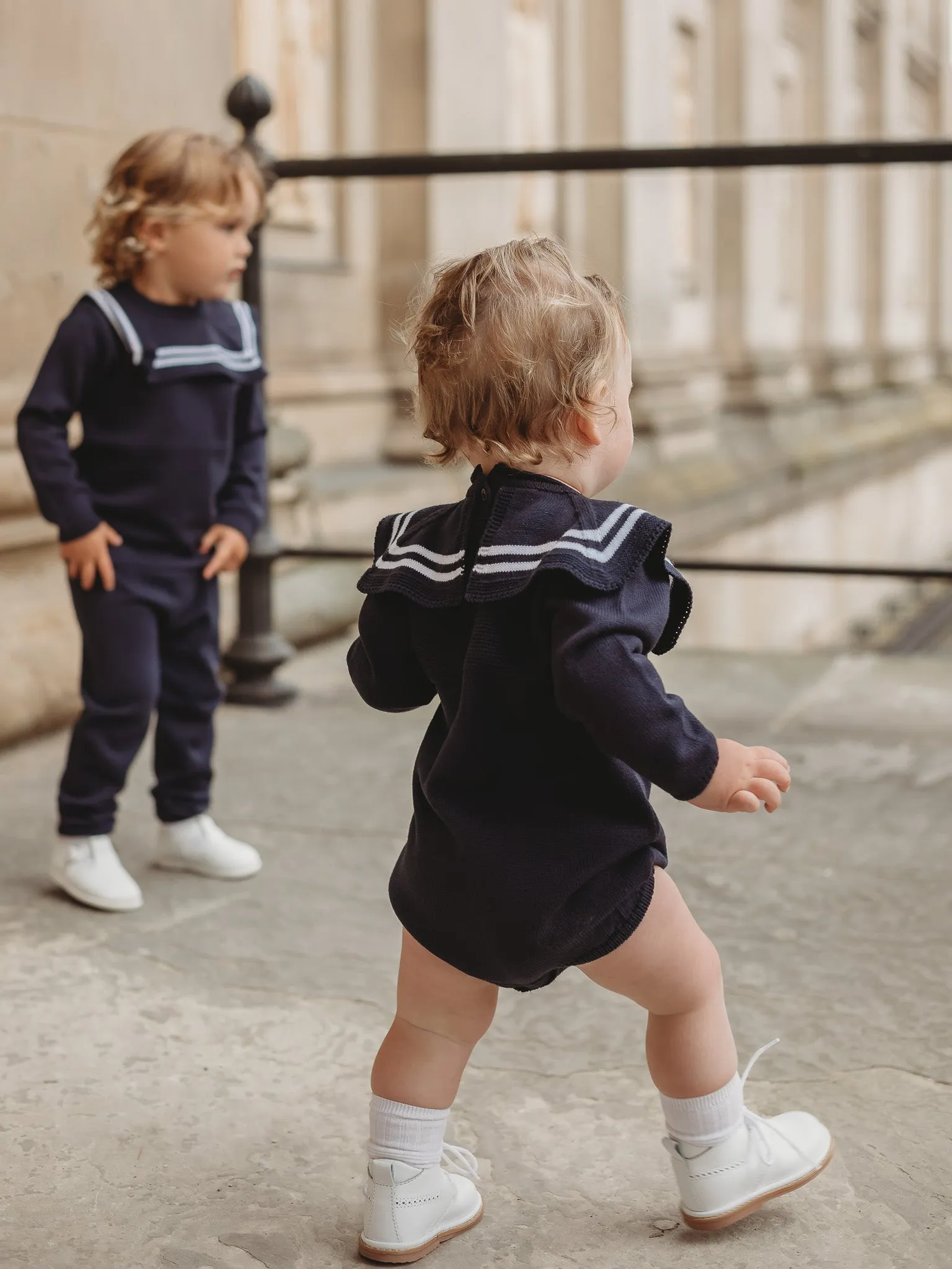 'Arhlo' navy & white knitted romper with sailor collar