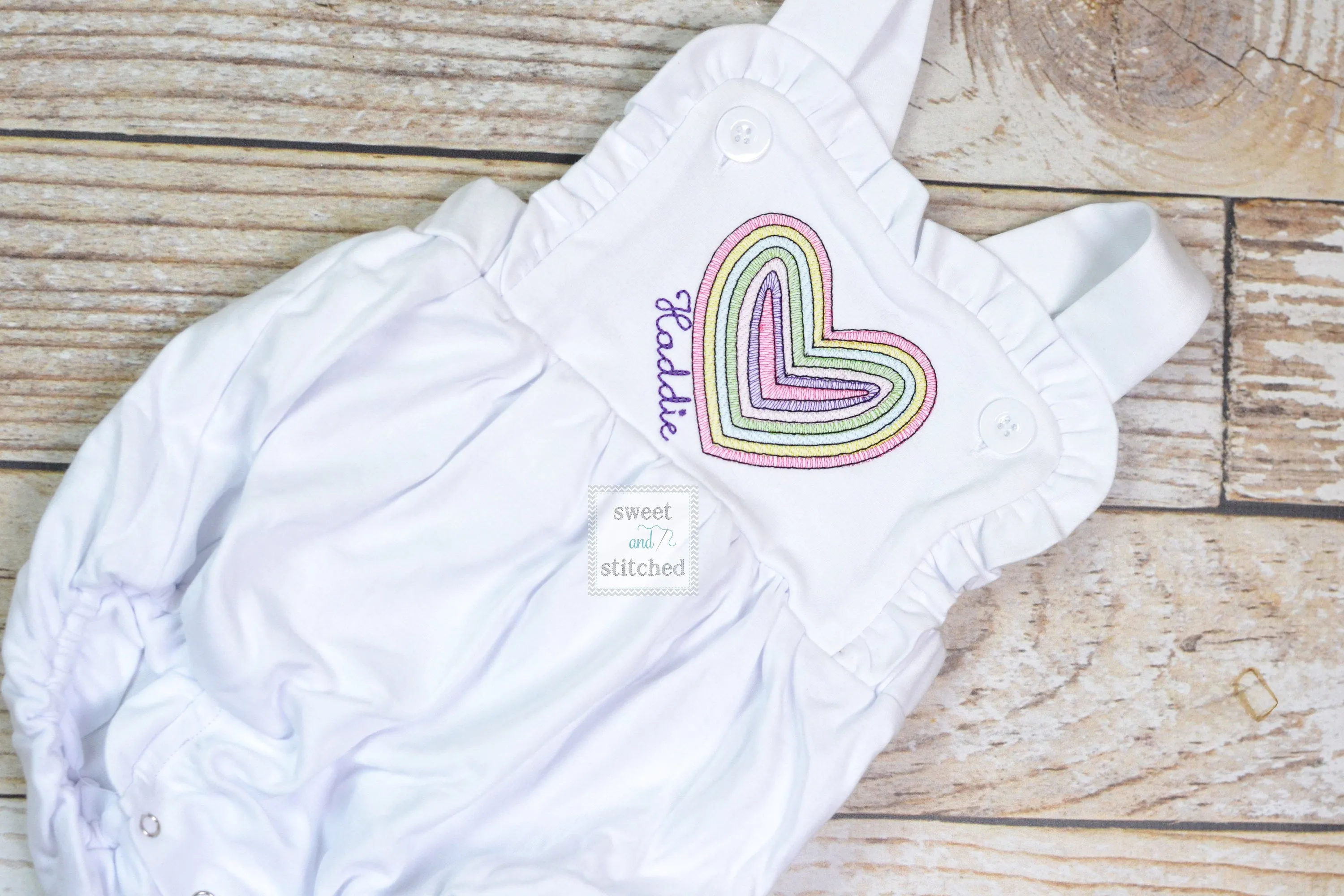 Monogrammed baby girl Valentine's outfit with vintage rainbow heart design