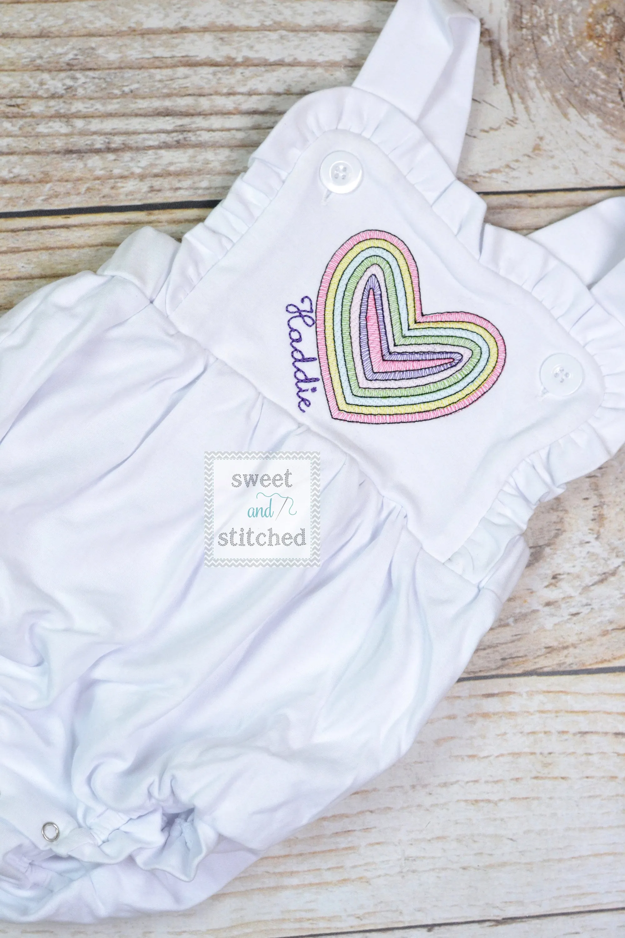 Monogrammed baby girl Valentine's outfit with vintage rainbow heart design